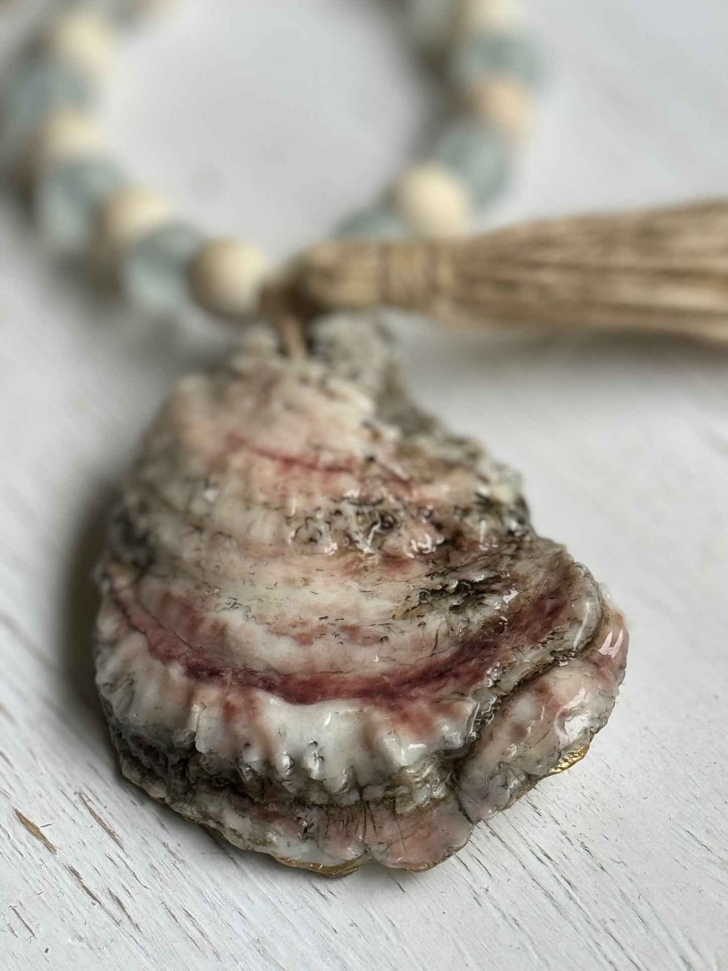 Handmade Oyster Shell Beaded Necklace – A stunning coastal-inspired jewelry piece featuring a natural oyster shell and intricate beaded design. Perfect for adding a touch of beach elegance to any outfit, this necklace is ideal for beach lovers, weddings, or as a personalized gift. A unique accessory that blends nature’s beauty with handcrafted artistry.